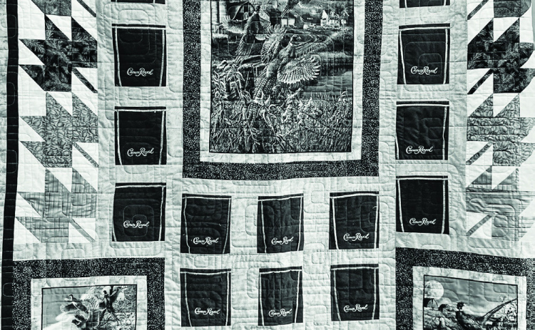 Raffle tickets for the Crown Royal quilt (above) made by Deloris Fuegen and Jean Scheel is currently on display at the Jerauld County Court House. Tickets may be purchased from Jean Ferguson and the winner will be drawn at the Pair of Jacks Golf Tournament to be held at Springs Country Club May 29. All proceeds from the raffle will benefit the Wessington Springs High School golf team.