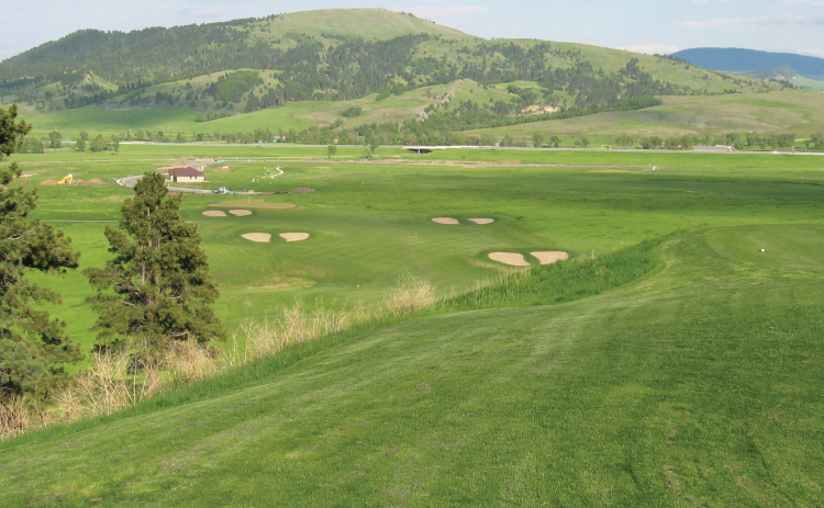 Bunkers shaped like elk hoof prints border the fairway on Elkhorn Ridge Golf Club’s signature fifth hole near Spearfish
