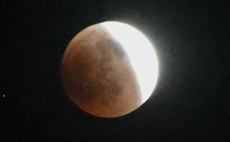 This series of photos shows the moon in various stages of the total lunar eclipse during the first blood moon of the year, in Wessington Springs, SD on May 15, 2022.