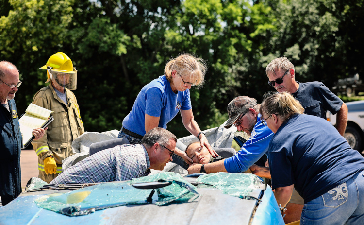 EMTs and firemen from Jerauld County and the surrounding area took part in a day-long training in Wessington Springs Saturday. Trainees are shown practicing a scenario involving a mock auto accident and extrication.