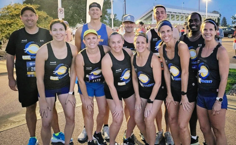 437 Project runners (Left to right): Matt Smith, Whitney Lucas Molitor, Allison Weber, Paul TenHaken, Kristen De Berg, Ryan Flogstad, Lesley Fite-Boltjes, Alex Pool, Wendy Johnson, Benson Langat, Kelly Marshall (missing from the photo is runner Greg Koch).