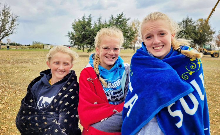Pictured left to right, Alexis Roesler, Ella Kolousek and Abby Kolousek advance as a team to the state cross country meet October 22, 2022. PHOTO COURTESY BECKY KRUEGER