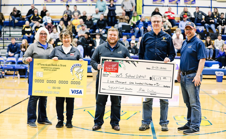 Employees from American Bank & Trust, Wessington Springs branch, presented a check to the school district in the amount of $5,113. The funds will be directed to a locker project at the elementary school.