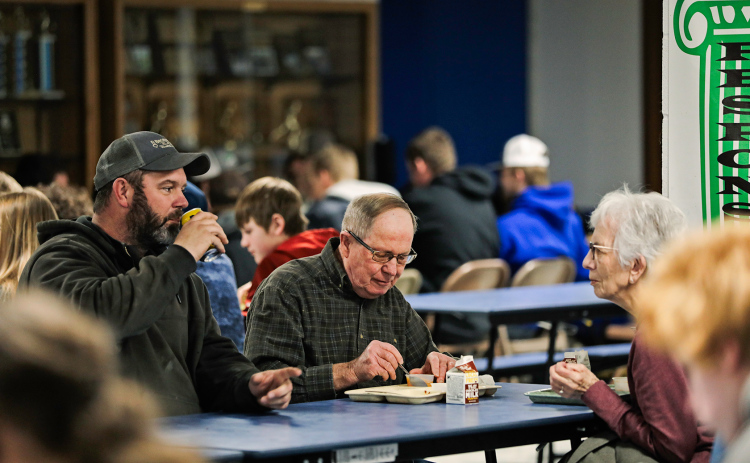 Dustin Weber, Delvin and Lois Feistner were among community members who enjoyed Homegrown Lunch Day last Tuesday.