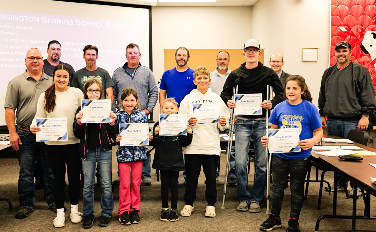 Pictured, back row: BOE members Darrick Van Dyke, Derek Zastrow, Scott Kolousek, Dustin Weber, Gene Gaikowski, Superintendent Dr. Michael Ormsmith, BOE member Jonathan Arhart. Front row: Humm-Dinger owner Jason Zacher, students Remie Roduner, Aliza Bolin, Blair Murphy, Mayzie Miller, Jace Kolousek, Luke Larson, Bailey Mentele. KRISTI HINE / TRUE DAKOTAN