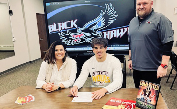 Shown left to right during a letter of intent signing with Northern State University are Becka Havlik, Holden Havlik and Head Blackhawks Coach Michael Schmitz. Holden Havlik signed to play quarterback at Northern State University. PHOTO COURTESY BECKA HAVLIK