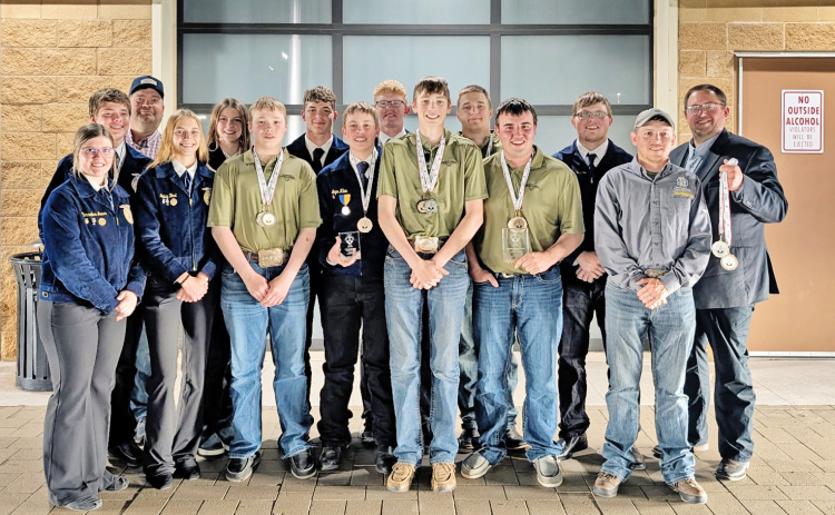 A large group from Wessington Springs is pictured in Oklahoma City at the National Land and Range Judging Contest. Back row, left to right: Kohen Mebius, Chaperone Wade Christensen, Addyson Orth, Peyton Walz, Luke Larson, Robert Hine, Holden Jackson, FFA Advisor Brady Duxbury. Front row: Mercedes Jones, Bailey Yost, Hayes Christensen, Logan Klein, Landen Christensen, Ridge Roduner, coach Tyler Swan.