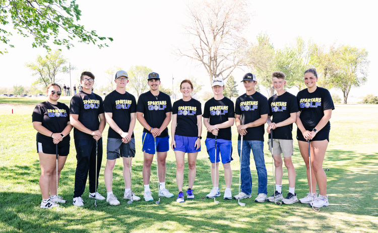 Varsity Spartan golfers, left to right: Taylor Braun, Brett Miller, Luke Larson, Blake Miller, Head Coach Regina Teveldal, JD Thompson, Heyns Bothma, Tucker Thompson, Kaitlyn Braun.
