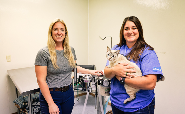 KRISTI HINE / TRUE DAKOTAN Veterinarian Dr. Megan Tuschen and Vet Tech Morgen Schroeder are shown with their feline friend, Marshmallow, at Prairie View Vet Clinic on Monday, July 1, 2025. The vet clinic recently announced an upcoming, low-cost, cat spay and neuter clinic scheduled for July 25, 2025. The clinic asks the public to call ahead to register at 605-539-0009.