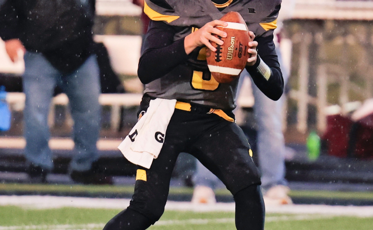 Ty Boomsma is pictured during a soggy football homecoming match up vs. Platte-Geddes Friday.