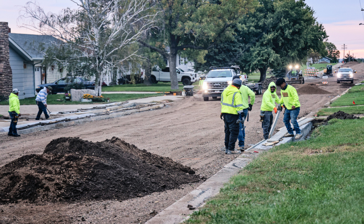 A crew from Rexwinkel Concrete works in the early morning hours placing forms in preparation for pouring curb and gutter on 2nd Street east of Barrett Avenue in Wessington Springs Monday, October 6, 2025. After weeks of delays, project engineer Brad Lawrence of Brosz Engineering said progress improved when the city contacted the contractor’s bond company, prompting the contractor to bring in additional workers and equipment to get the long-troubled street project back on track. (KRISTI HINE / TRUE DAKOTAN)