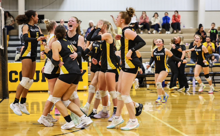 The Lady Warbirds celebrate after sweeping De Smet in straight sets during Round 3 of Region 3B play on Nov. 6 in Wolsey. The win advanced Wolsey-Wessington to the SoDak 16 and one step closer to a berth in the state tournament.
