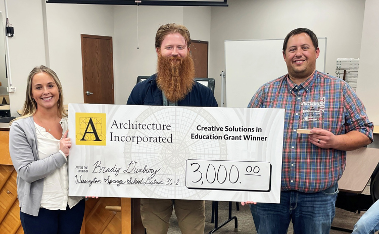 WSHS Vo-Ag Instructor Brady Duxbury (right) is awarded a grant from Architecture Incorporated.