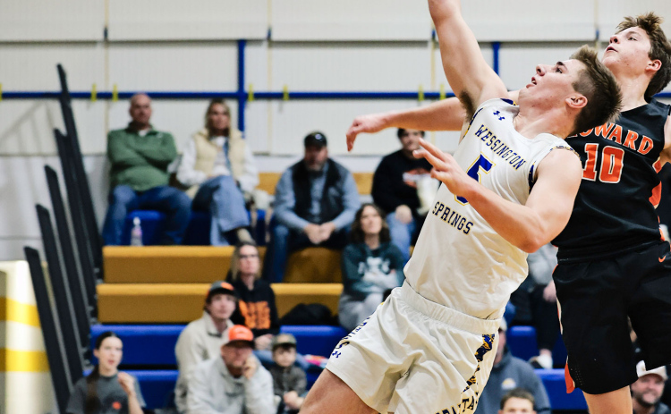 Colby Flowers goes up for a driving layup during Wessington Springs’ 64-58 win over Howard on Saturday, Dec. 20. Flowers led the Spartans with 20 points, shooting 9-of-14 from the field while adding two assists and two blocks
