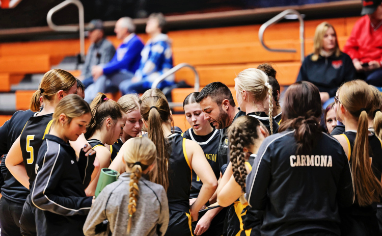 Wolsey-Wessington Head Girls Basketball Coach Josh McGillvrey draws up a play during a timeout at the 281 Conference Tournament at Huron Arena earlier this season. Though the Lady Warbirds’ postseason run came to a close, the team finished the year proud of its growth and optimistic about what lies ahead. (TRUE DAKOTAN FILE PHOTO)