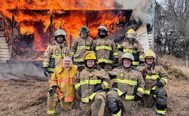 Area firefighters take part in a live burn training during Firefighter I and II certification hosted by Wessington Springs Volunteer Fire Department (WSVFD). Pictured are (back, from left) WSVFD fireman Erik Kurth, Kolby Sinkie of Pukwana Volunteer Fire Department , WSVFD firemen Aryan Schooler and Jonathan Jooste; (front, from left) instructor Brian Baldwin, WSVFD firemen Tyler Fastnacht, Blake Willman and Coy Fastnacht. (PHOTO COURTESY WSVFD)