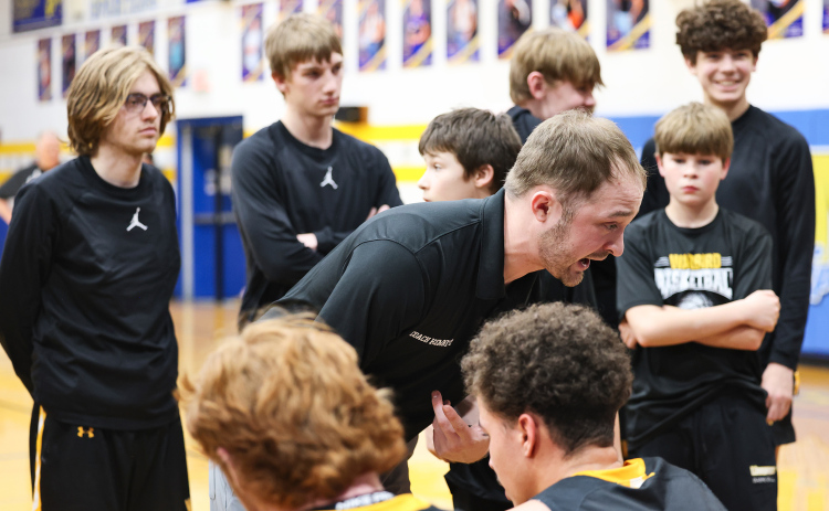 Wolsey-Wessington head coach Austin Kemnitz encourages his players from the sideline during the Warbirds’ Region 2B quarterfinal matchup against Wessington Springs on Tuesday, March 3.  View more photos from the game at www.truedakotan.com, click on Photo Galleries. (KRISTI HINE / TRUE DAKOTAN)