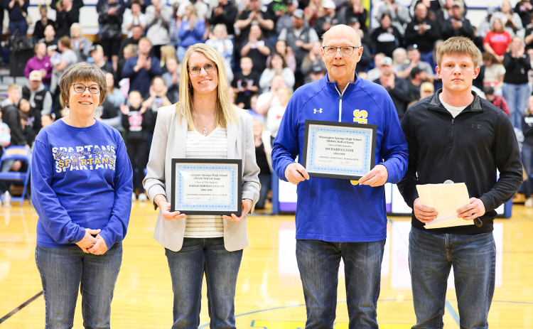 From left: WSHS Athletic Hall of Fame committee member Julie Kraft, 2026 inductee Sarah (Horsley) Larson, Mike Mebius accepting on behalf of the Richard Cutler family, and Dylan Schimke, founder of the WSHS Athletic Hall of Fame, during Friday’s induction ceremony.