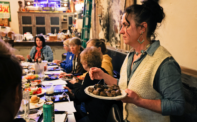 Heather Larson of Sweet Grass serves beef samples during a cooking demonstration that allowed Women’s Ag Network attendees to compare how different cuts and cooking methods affect tenderness and flavor. (KRISTI HINE / TRUE DAKOTAN)