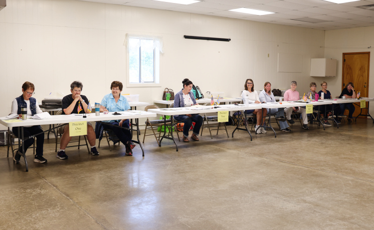 Poll workers assist voters Tuesday morning at the Jerauld County Ag Building in Wessington Springs during South Dakota’s Republican Primary Election. Election officials remind voters that multiple ballot styles are being used this year based on party registration and residence, leading to some confusion at polling places. 