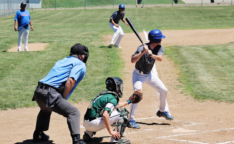 Dylan Schimke bats with Brock Krueger at third base during Sunday’s doubleheader against Chamberlain. Schimke drove in five runs across the two games as the Owls swept the Mallards. (PHOTOS BY CRAIG WENZEL FOR THE TRUE DAKOTAN)