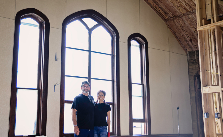 Jim and Carolyn Ferguson stand inside the former United Church of Christ in Wessington Springs, where they have spent the past several years transforming the historic church into their home. The large west-facing windows behind them will eventually be replaced with double doors, creating the home’s new main entrance and opening onto a covered deck.