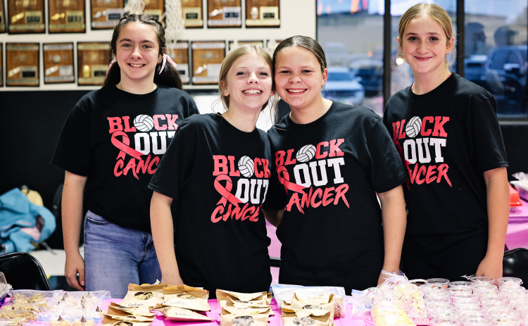 Olive Black, Kora Klusman, Kennidee Kunze and Kenley Walters help with the bake sale.