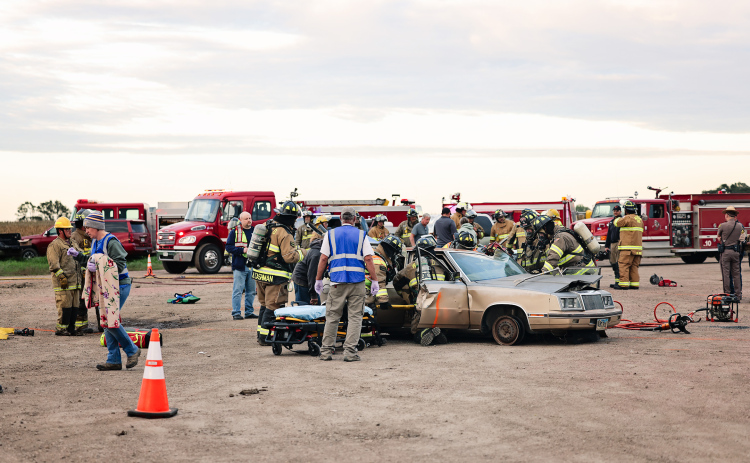 Emergency responders work through a simulated three-vehicle crash during a multi-department mass casualty drill Oct. 1 near the Highway 34 and 281 junction. The exercise brought together area fire departments, ambulance services, law enforcement, hospital and nursing home staff and dispatchers to practice coordinating their response to a complex emergency. (KRISTI HINE / TRUE DAKOTAN)