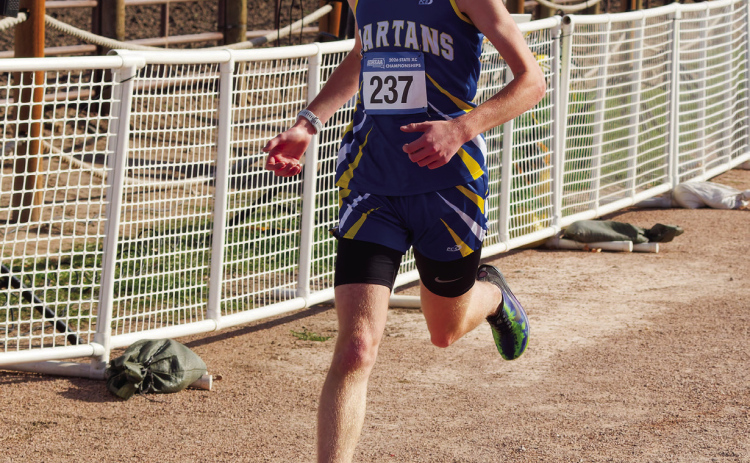 With determination etched across his face, Wessington Springs’ Carson Clements crosses the finish line at the South Dakota Class B State Cross Country Championships on Saturday, Oct. 24, at Hart Ranch Camping Resort near Rapid City. Clements placed fourth among 125 runners, clocking a personal-best time of 16 minutes, 33.3 seconds in the 5-kilometer race. (PHOTO COURTESY SDPB)
