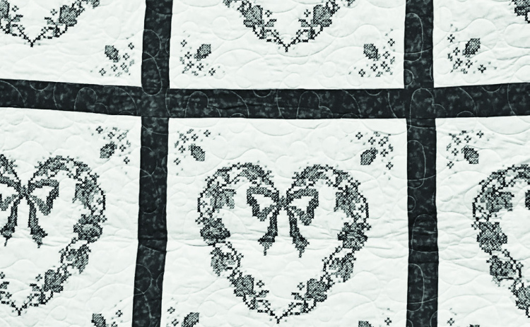 Sharon DiCarlo has donated the blue, pink and green cross stitch embroidered quilt pictured above to a fundraiser for the Wessington Springs Senior / Community Center.