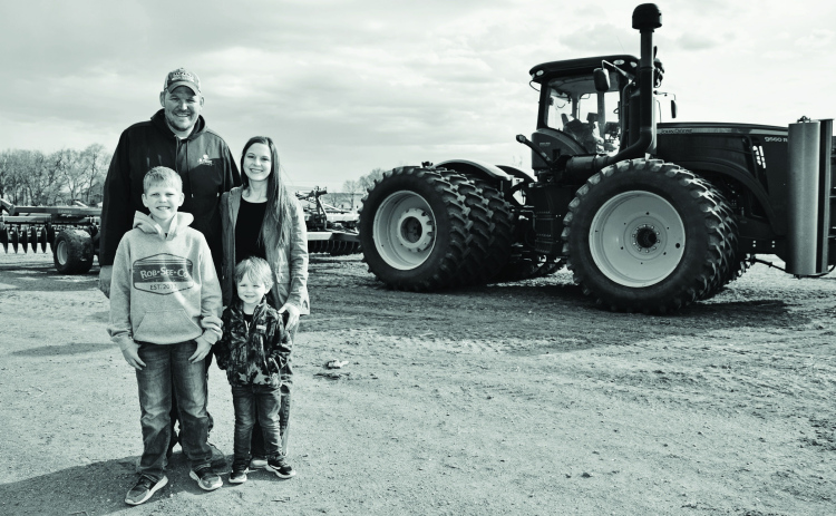 The Albrechts farm near Alpena, Chris and Amy with their sons, Cade and Cale. PHOTO COURTESY SDFU
