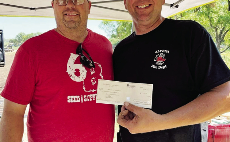 Pictured is Rob Baruth, (left) of the Alpena Community Foundation and Gerry Orth, Fire Chief for the Alpena Fire Department.
