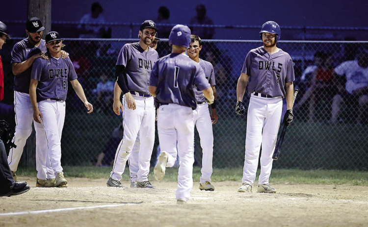 PHOTO COURTESY RODNEY HAAS/605 SPORTS Wessington Springs Owls celebrate as Blake Larson crosses home plate. Larson added a solo home run as part of a two-hit day during a district battle vs. Burke.