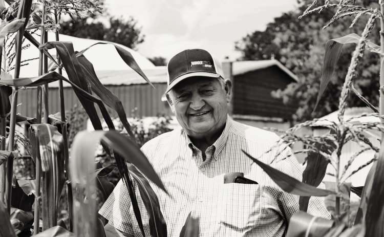 Ron Neugebauer stands in a patch of sweet corn in his garden west of Dimock, S.D. (Photo: Abbey Stegenga / SD News Watch)